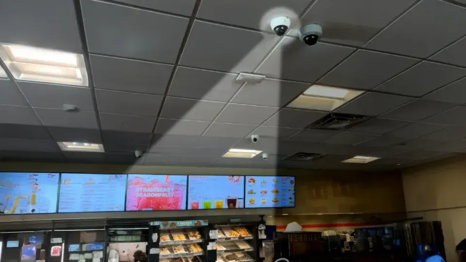 Ceiling cameras watching a restaurant counter